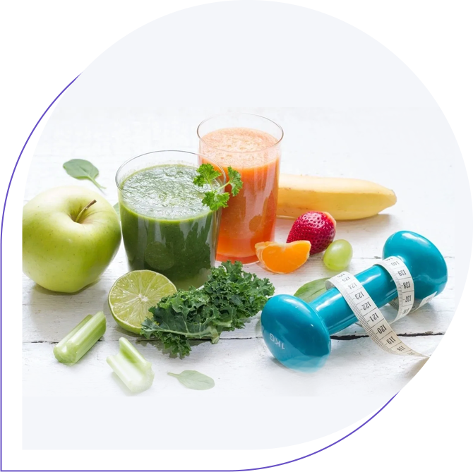 A table topped with fruits and vegetables next to a blue dumbbell.