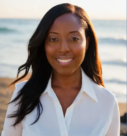 A woman standing on top of a beach near the ocean.