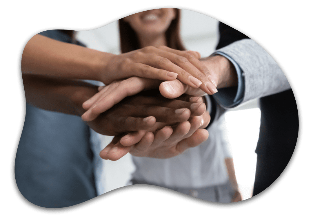 Hands stacked in a teamwork gesture.