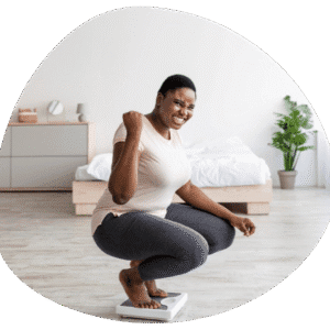 Person celebrating on a bathroom scale.